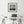 Gannet diving picture in black frame above a modern black and white office desk