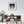 Dining room with wooden table and chairs, framed picture of a Little Egret white bird on the wall.