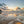 Beach scene with waves and sunset clouds